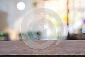 Image of wooden table in front of abstract blurred background