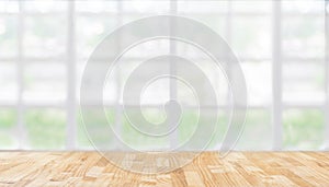 Image of wooden table in front of abstract blurred restaurant li