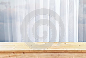 image of wooden table in front of blurred window light