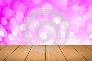 Image of wooden table in front of bokeh background