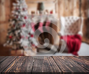 Image of wooden table in front of christmas blurred background o