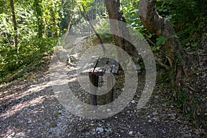 Image of a wooden table located along a path in a park. Vacation in Abruzzo Majella National Park,