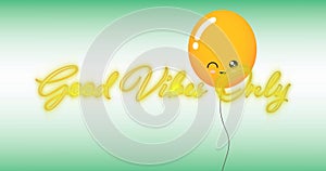 Image of the words good vibes in flickering yellow neon with orange balloon on green and white