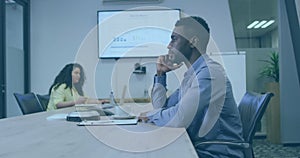 Image of world map and icons over african american man working in office