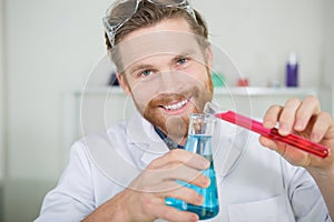 image young chemist experimenting with substances