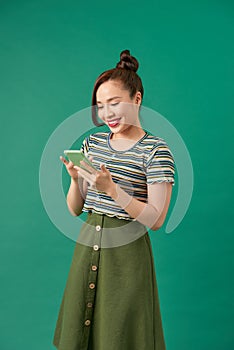 Image of young female using cellular phone