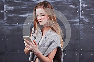 Image of young female using cellular phone