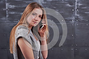 Image of young female using cellular phone