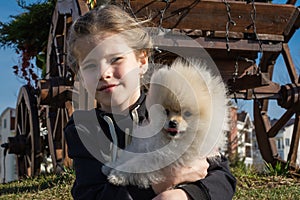 Image of young girl with her dog