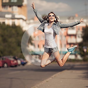 Image of young happy woman, listening music and having fun