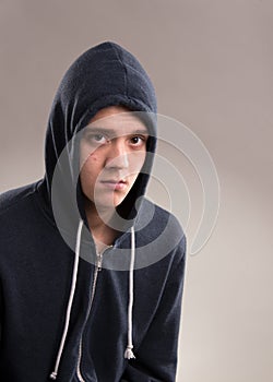 Image of young man in hooded sweater