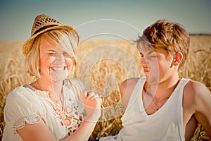 Image of young man and woman on wheat field