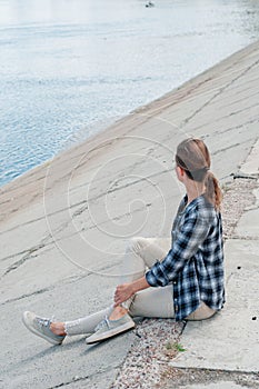 Image of young woman of river