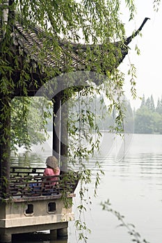 Image of young women relaxing at The Xihu lake