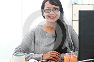Images of beautiful young woman architect working on her compute