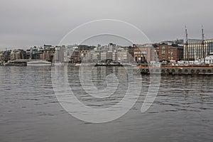 Buildigns of Aker Brigger, Oslo, Norway - cloudy evening.