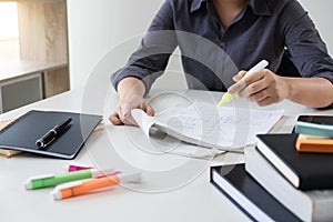 Images of studying student hands writing in book during lecture