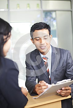 Images of two businessman discussion work