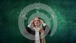 Imagination in problem solving concept. Portrait of woman isolated on green background light bulb image on top. Girl