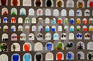 Imaginative display of bright colourful glasswork in a craft and design shop in Florence