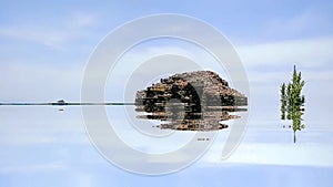 Imaginative representation with the nuraghe Su Nuraxi of Barumini, UNESCO World Heritage, almost submerge by the waters