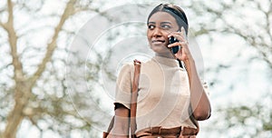 Imagine, believe, achieve. Cropped portrait shot of an attractive young female student using her mobile phone outside on