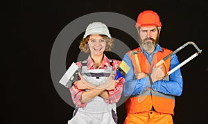 Imagine their new house. Portrait of confident handyman and his female colleague. follow repairing steps. wear special