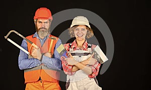 Imagine their new house. Portrait of confident handyman and his female colleague. follow repairing steps. wear special