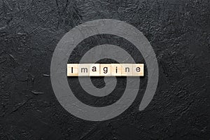imagine word written on wood block. imagine text on table, concept