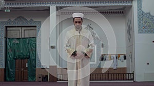 Imam praying takbir in mosque