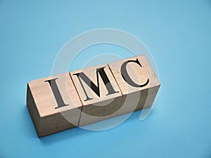 IMC integrated marketing communication, text words typography written with wooden letter, life and business motivational