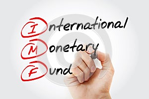 IMF - International Monetary Fund acronym with marker, business concept background