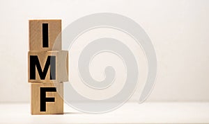 IMF Spelled with Wood Tiles Isolated on a White Background