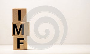 IMF Spelled with Wood Tiles Isolated on a White Background photo