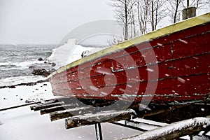 An Old Boat Weathers a Snow Storm photo