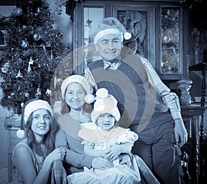 Imitation of antique photo of happy family in Christmas