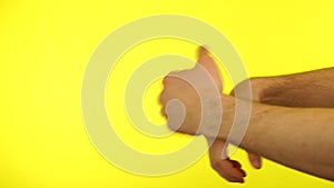 Imitation of boxing punching bag on yellow background.