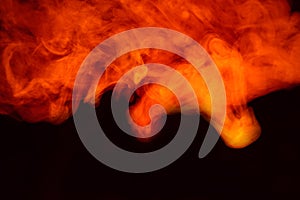 Imitation of bright flashes of orange-red flame. Background of abstract colored smoke