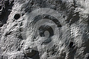 Imitation of the lunar surface of silver color with craters
