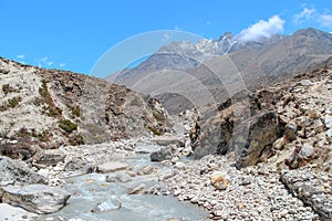 Imja Khola river flows in Himalayas from Khumbu Glacier photo