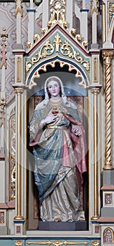 Immaculate heart of Mary statue on the Sacred heart of Jesus altar in the church of Saint Matthew in Stitar, Croatia