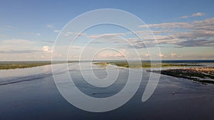 The immensity of the Amazon River with two ships as scale of the magnitude