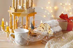 Immerse yourself in New Year atmosphere with German Christmas cake stollen, beautifully Festive Decorations, Christmas wooden