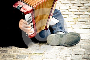 Immigrant playing accordion photo