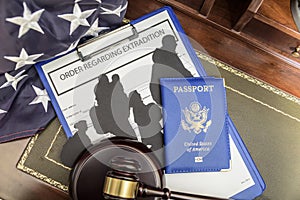 Immigration law concept. Gavel, passport and Silhouette of immigrants on wooden table.