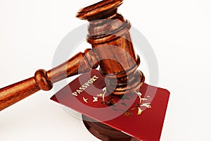 Immigration law concept with judge gavel and passport on an office table