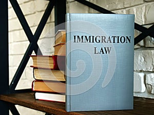 Immigration law or rules book on the shelf.