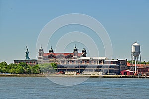 Immigration museum on Ellis Island with Statue of Liberty Behind