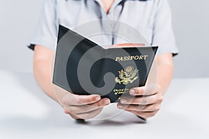 Immigration and passport control at the airport. woman border control officer puts a stamp in the US passport of american citizen