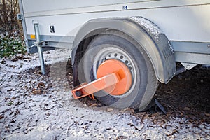 An immobilizer from the public order office is attached to one wheel of a trailer